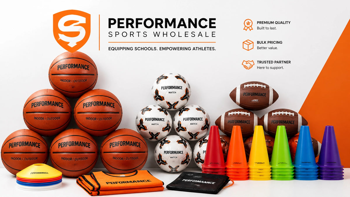 Pyramids of basketballs, soccer balls, and footballs beside stacks of colored training cones, disc markers, and folded pinnies